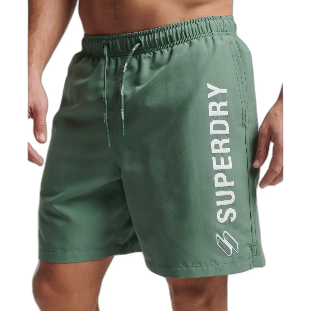 5059726547134 - Herren 19-Zoll-Badeshorts mit Applikation aus Recyceltem Material Grün - Größe S