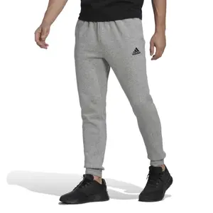 Spodnie dresowe zwężane z dresówki adidas Essentials image-1
