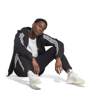 Fleece Jogginghose mit schmaler Passform adidas Essentials 3-Stripes image-3