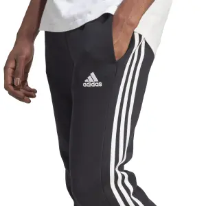 Fleece Jogginghose mit schmaler Passform adidas Essentials 3-Stripes image-5