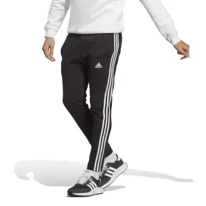Pantalón de chándal tapered con dobladillo abierto de jersey simple adidas Essentials 3-Stripes image-1