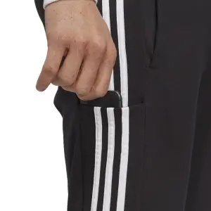 Pantalón de chándal tapered con dobladillo abierto de jersey simple adidas Essentials 3-Stripes image-5