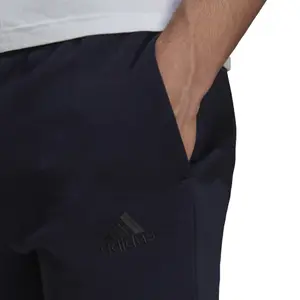 Pantalón de chándal adidas Essentials Fleece Tapered Cuff Logo image-5