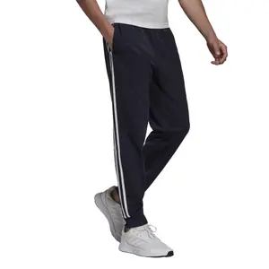 Pantalón adidas Primegreen Essentials Warm Up Tapered 3 Stripes image-2