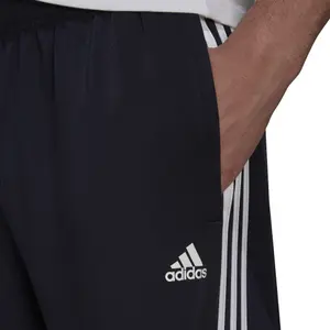 Pantalón adidas Primegreen Essentials Warm Up Tapered 3 Stripes image-4