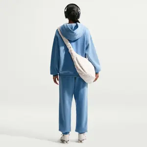 Damskie spodnie dresowe Nike Studio image-1