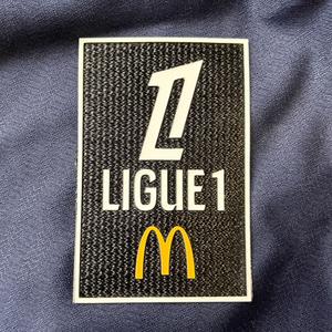 marking-003119-insignia-ligue-1-2024-negro-blanco-amarillo