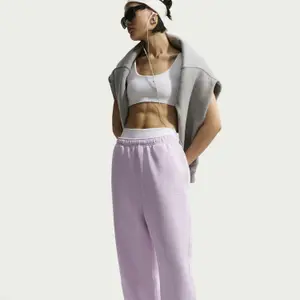 Damskie spodnie dresowe Nike Studio image-4