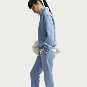 Damskie spodnie dresowe Nike Studio image-3