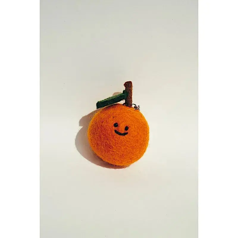 Oranje sleutelhanger met motief Meri Meri